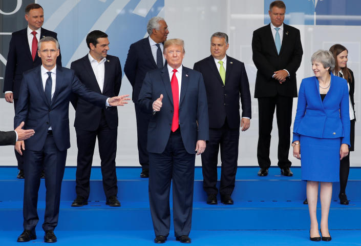 President Trump and other leaders pose for a photo at the start of the NATO summit in Brussels, July 11, 2018. (Photo: Yves Herman/Reuters)