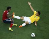 Colombia's Carlos Sanchez (L) and Brazil's Fred fight for the ball during their 2014 World Cup quarter-finals at the Castelao arena in Fortaleza July 4, 2014. REUTERS/Fabrizio Bensch