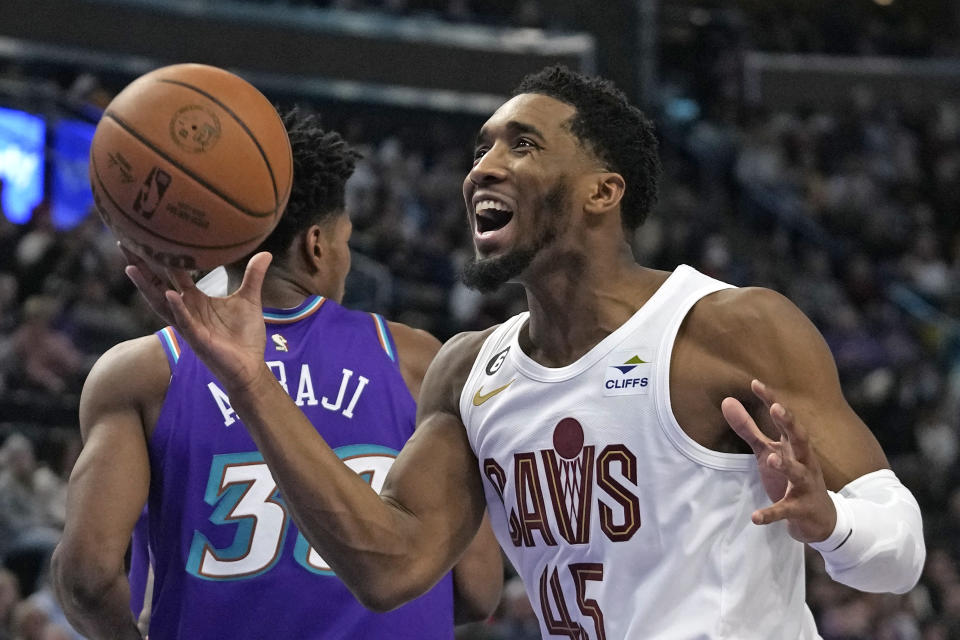 Cleveland Cavaliers guard Donovan Mitchell (45) reacts during the first half of an NBA basketball game against the Utah Jazz Tuesday, Jan. 10, 2023, in Salt Lake City. (AP Photo/Rick Bowmer)