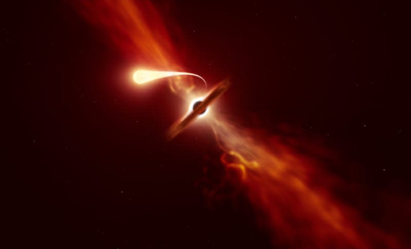 An artist's conception of a star getting spaghettified by a black hole, with jets on either side.