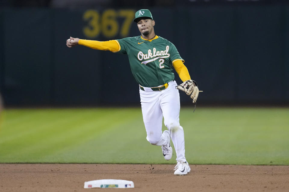 Oakland Athletics shortstop Darell Hernaiz throws out Pittsburgh Pirates' Joey Bart at first base during the fifth inning of a baseball game in Oakland, Calif., Tuesday, April 30, 2024. (AP Photo/Jeff Chiu)