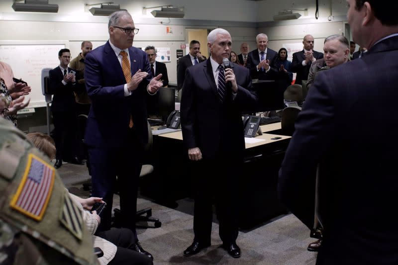 U.S. Vice President Mike Pence, who heads the government's coronavirus task force, speaks to personnel at the Washington State Emergency Operations Center during a tour with Governor Jay Inslee at Camp Murray near Tacoma