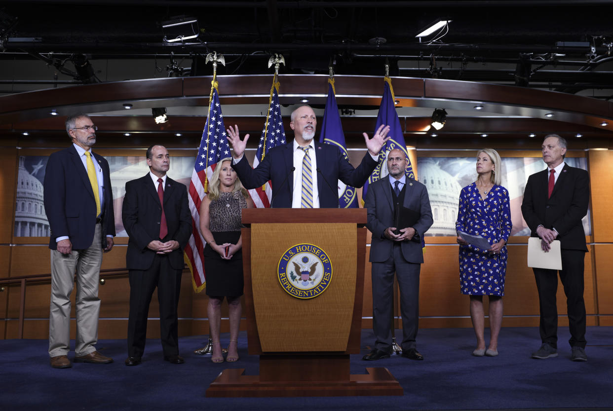 Rep. Chip Roy, joined by fellow Freedom Caucus members, speaks at a news conference (Kevin Dietsch / Getty Images file)