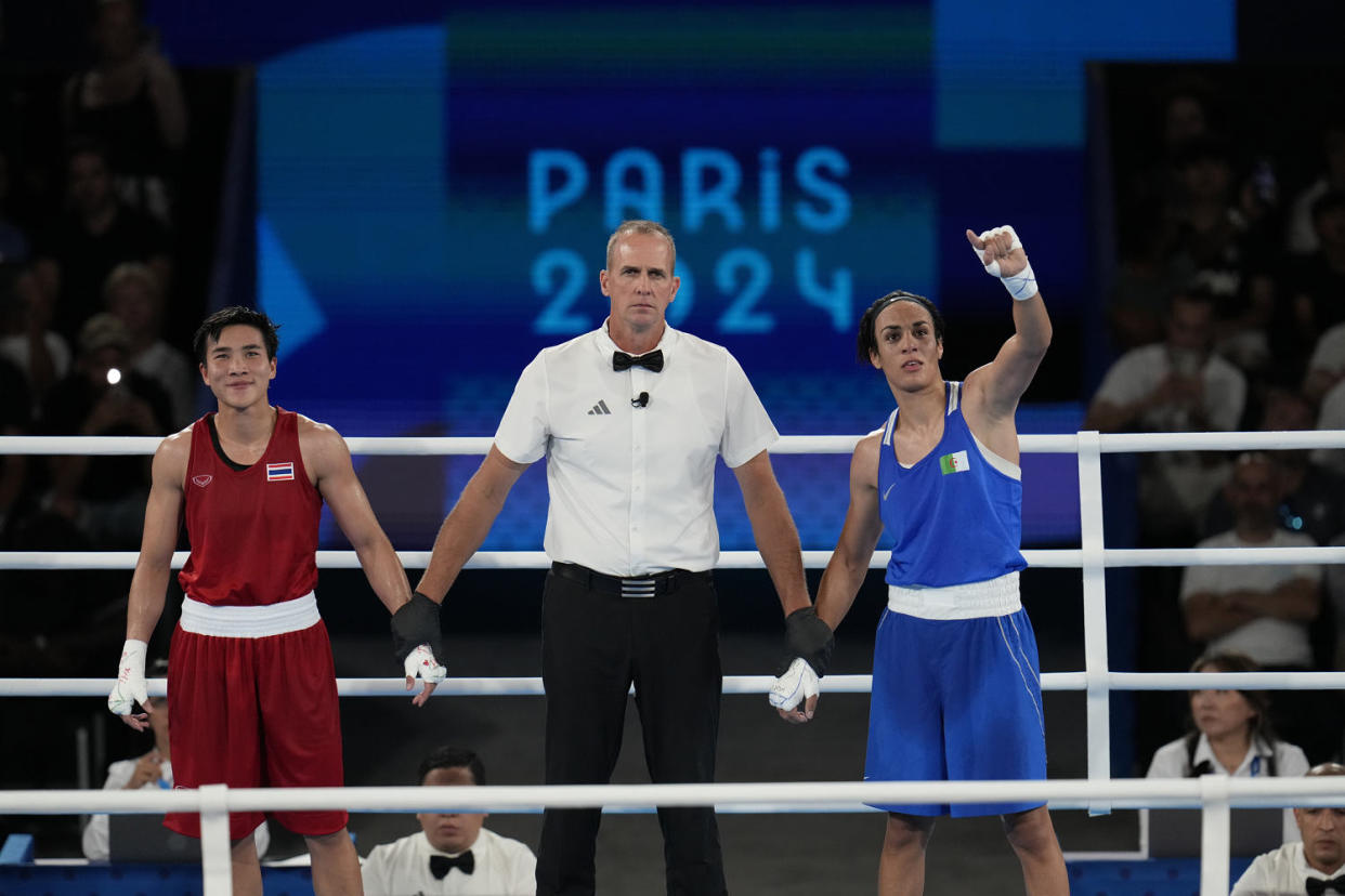 Algeria's Imane Khelif reacts after defeating Thailand's Janjaem Suwannapheng in their women's 66 kg semifinal boxing match at the Olympics on Aug. 6, 2024, in Paris. (Ariana Cubillos / AP)