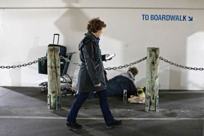 Mickey Marraffino locates a unhoused man in the parking deck at the Redondo Beach Pier during the 2022 homeless count