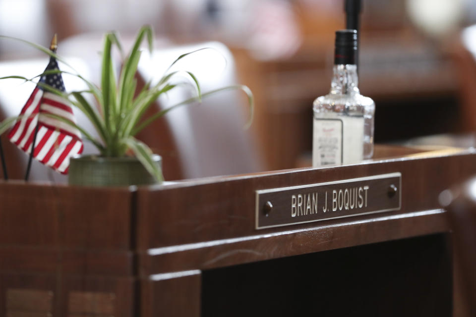 A desk in the Senate chambers belonging to Independent Sen. Brian Boquist is seen prior to a Senate session at the Oregon State Capitol in Salem, Ore., Friday, May 5, 2023. Sen. Boquist, along with four Republican senators, had unexcused absences for two prior days, preventing a quorum. (AP Photo/Amanda Loman)