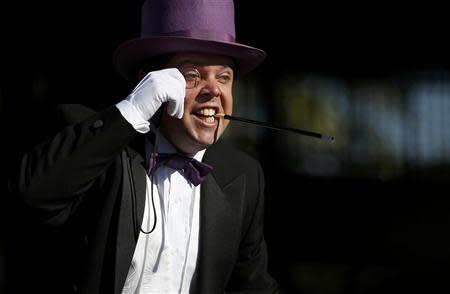 An actor portraying The Penguin awaits the arrival of five-year-old leukemia survivor Miles Scott, aka "Batkid", at AT&T Park as part of a day arranged by the Make- A - Wish Foundation in San Francisco, California November 15, 2013. REUTERS/Stephen Lam