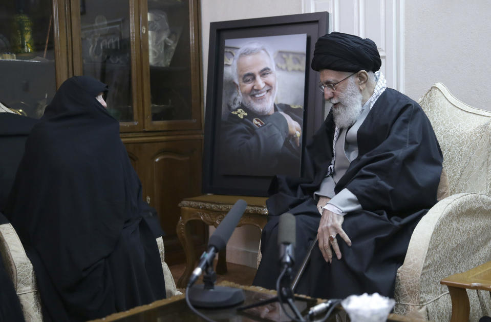 In this picture released by the official website of the office of the Iranian supreme leader, Supreme Leader Ayatollah Ali Khamenei, right, meets family of Iranian Revolutionary Guard Gen. Qassem Soleimani, who was killed in the U.S. airstrike in Iraq, at his home in Tehran, Iran, Friday, Jan. 3, 2020. Iran has vowed "harsh retaliation" for the U.S. airstrike near Baghdad's airport that killed Tehran's top general and the architect of its interventions across the Middle East. (Office of the Iranian Supreme Leader via AP)