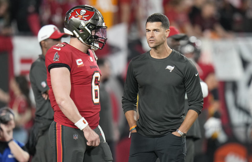 FILE - Tampa Bay Buccaneers quarterback Baker Mayfield (6) talks to offensive coordinator Dave Canales during the first half of an NFL wild-card football game against the Philadelphia Eagles Monday, Jan. 15, 2024, in Tampa, Fla. The Carolina Panthers have agreed to hire Tampa Bay Buccaneers offensive coordinator Dave Canales as their new head coach, according to two people familiar with the situation. (AP Photo/Chris O'Meara, File)