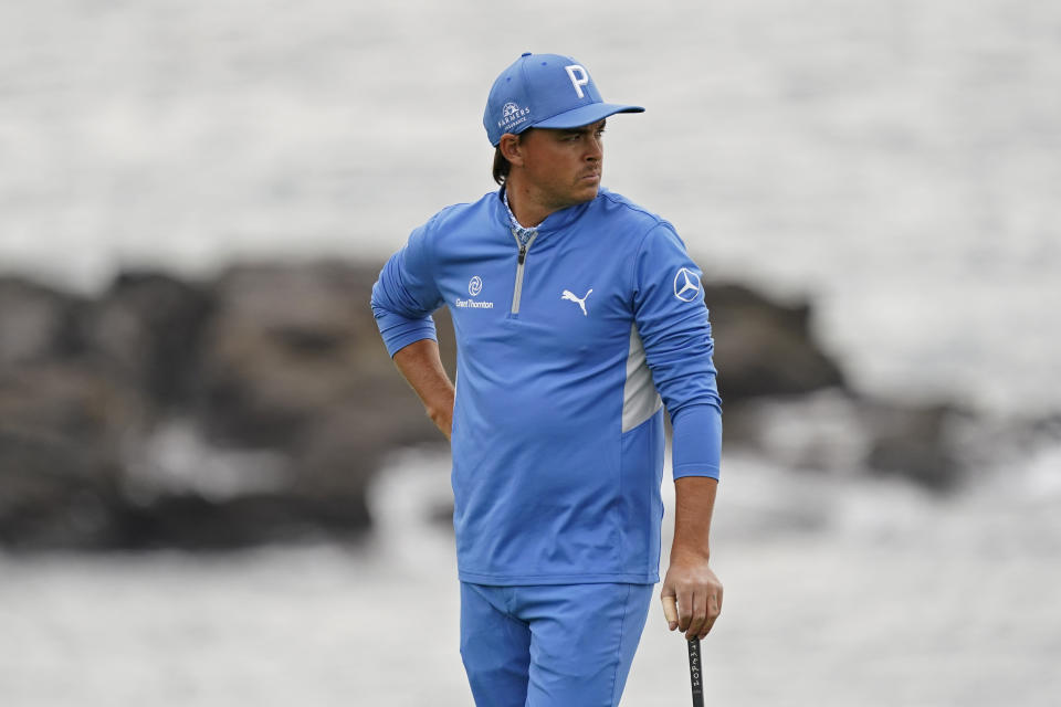 FILE - In this Feb. 11, 2021, file photo, Rickie Fowler looks out from the eighth green of the Pebble Beach Golf Links during the first round of the AT&T Pebble Beach Pro-Am golf tournament in Pebble Beach, Calif. For the first time, Fowler needed a special invitation to play in the PGA Championship next week. (AP Photo/Eric Risberg, File)