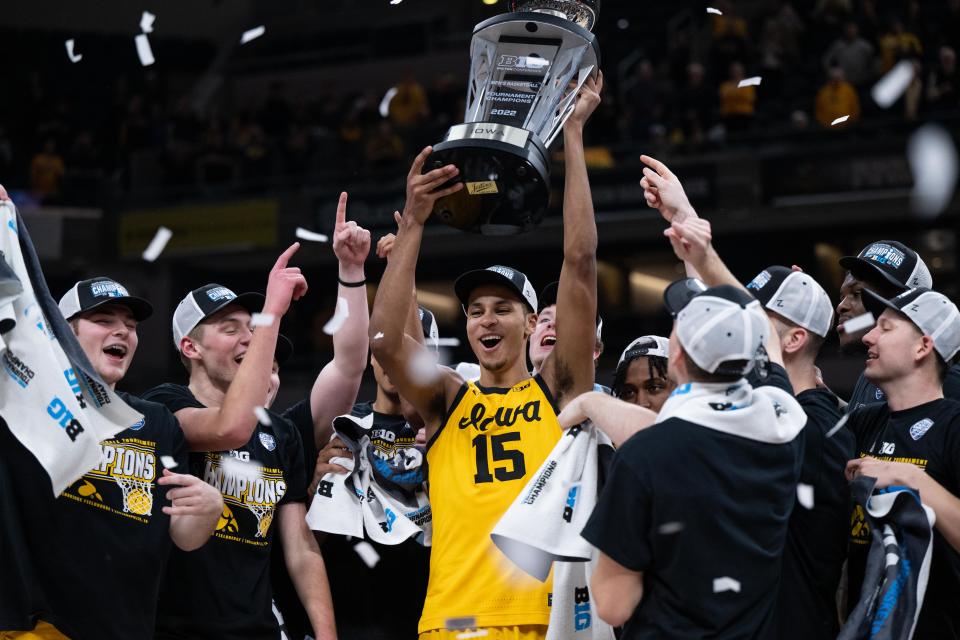 INDIANAPOLIS, IN - MARCH 13: Iowa Hawkeyes forward Keegan Murray (15) holds up the championship trophy after winning the mens Big Ten tournament college basketball game between the Iowa Hawkeyes and Purdue Boilermakers on March 13, 2022, at Gainbridge Fieldhouse in Indianapolis, IN. (Photo by Zach Bolinger/Icon Sportswire via Getty Images)