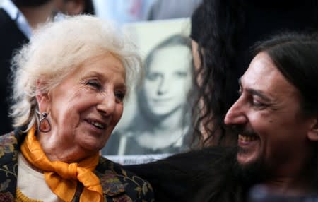 Javier Matias Darroux Mijalchuk, son of Elena Mijalchuk and Juan Manuel Darroux, who disappeared during Argentina's former 1976-1983 dictatorship, speaks with the president of human rights organisation de Carlotto, during a news conference in Buenos Aires