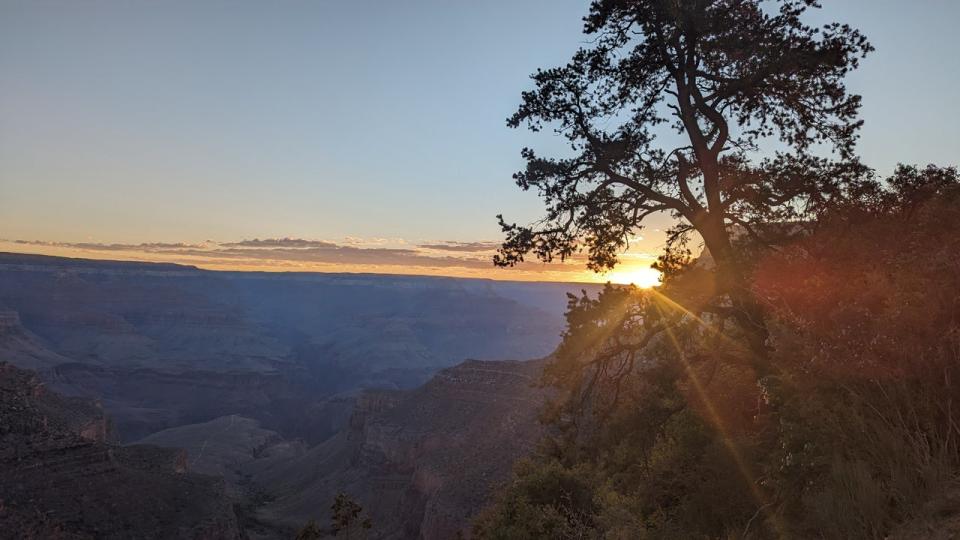 <div>The sun peeks out from behind the Grand Canyon to start a new spring day. Thanks to Jason DeBus for sending this photo.</div>