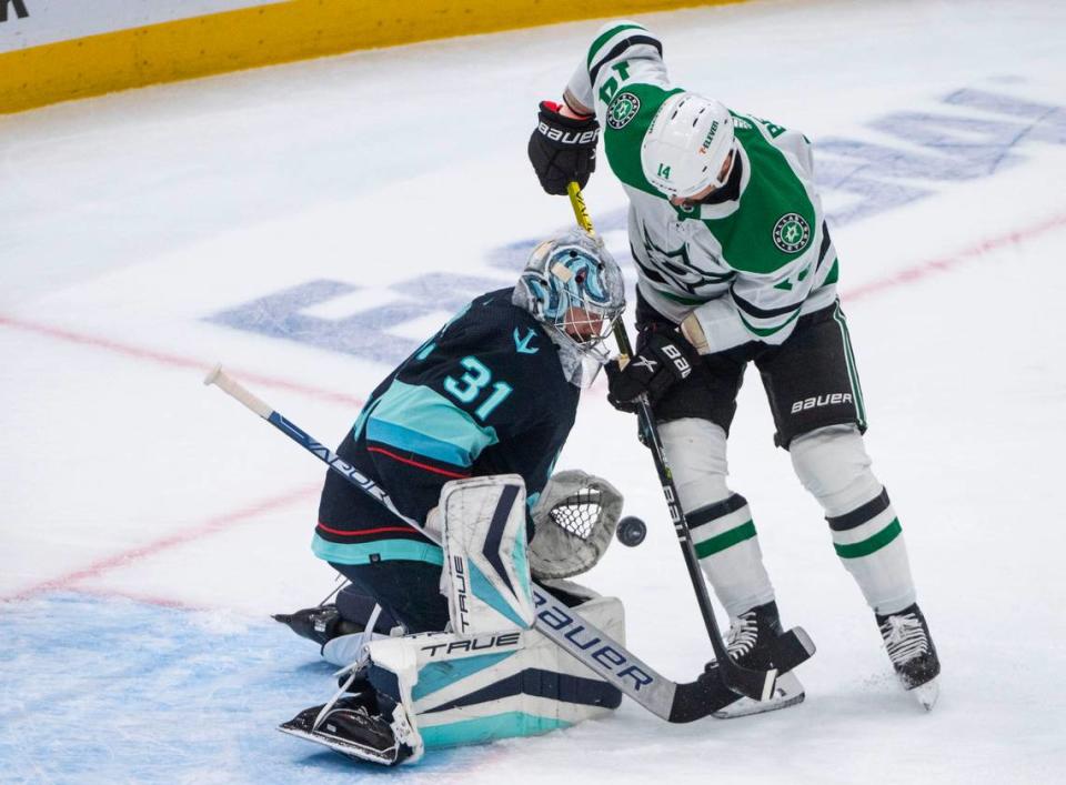 Seattle Kraken goaltender Philipp Grubauer (31) blocks Dallas Stars left wing Jamie Benn (14) from scoring during the first period of game four of the second round of the 2023 Stanley Cup Playoffs in Seattle, Wash. on May 9, 2023.