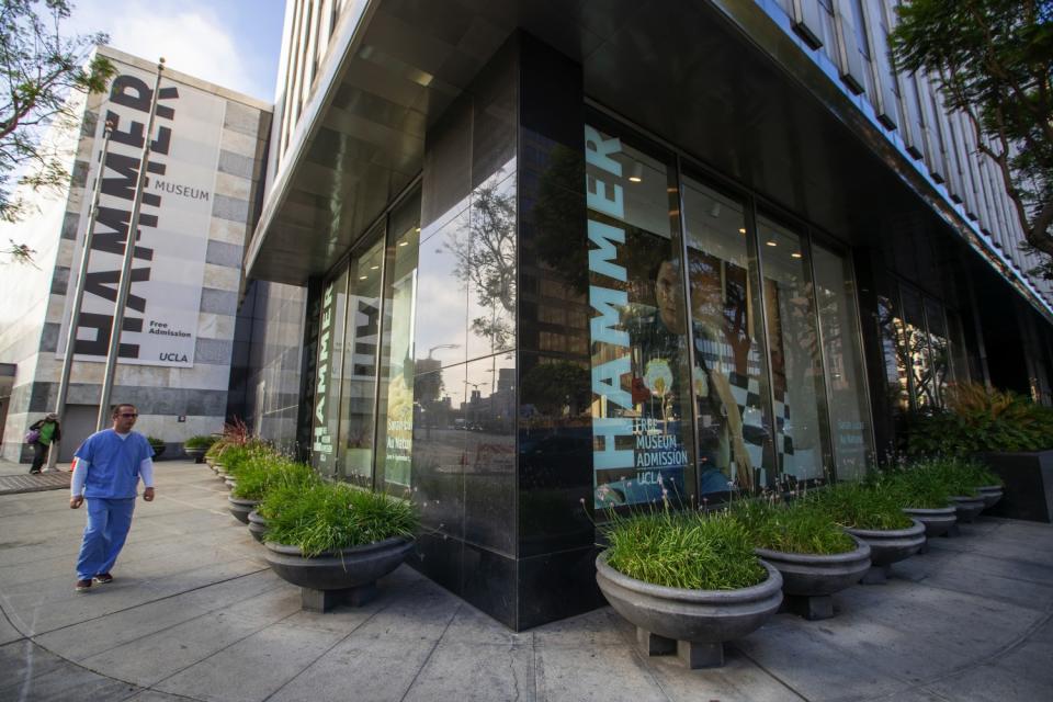 A man walks by the Hammer Museum in Westwood.