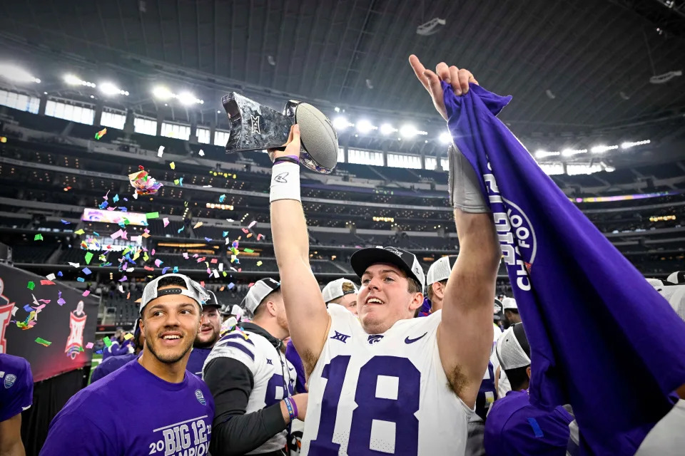 Kansas State quarterback Will Howard (18) holds up the 2022 Big 12 championship trophy after the Wildcats' 31-28 victory over TCU on Dec. 3 in Arlington, Texas.