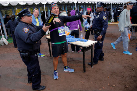 Athletics - New York City Marathon - New York, U.S. - November 5, 2017 - New York Police conduct security checks as runners check in for the New York City Marathon. REUTERS/Andrew Kelly