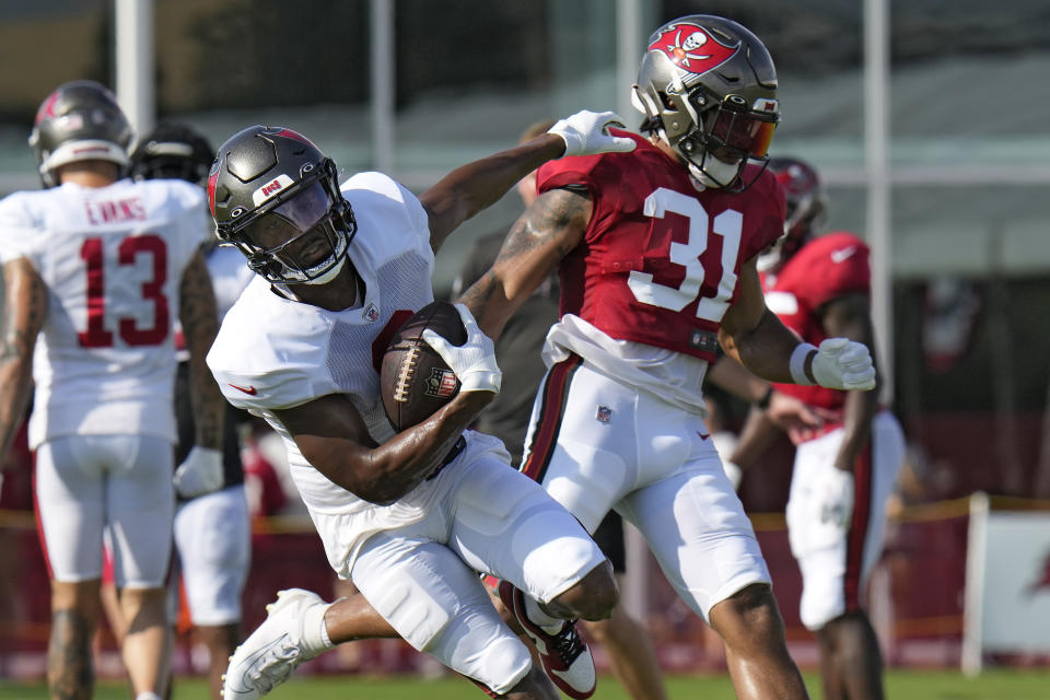 Tampa Bay Buccaneers wide receiver Russell Gage (3) beats safety Antoine Winfield Jr. (31) on a reception during an NFL football training camp practice Monday, July 31, 2023, in Tampa, Fla. (AP Photo/Chris O'Meara)