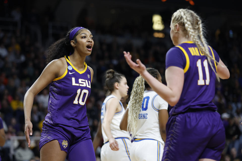 LSU's Angel Reese (left) interacts with teammate Hailey Van Lith during a Sweet 16 win on Saturday. (Photo by Sarah Stier/Getty Images)
