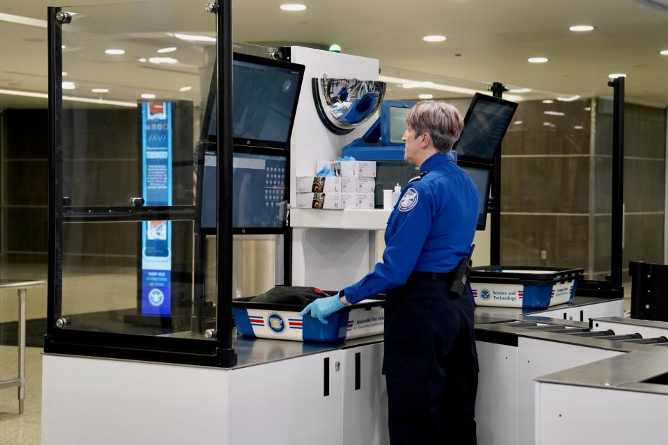 Staff at self service security check
