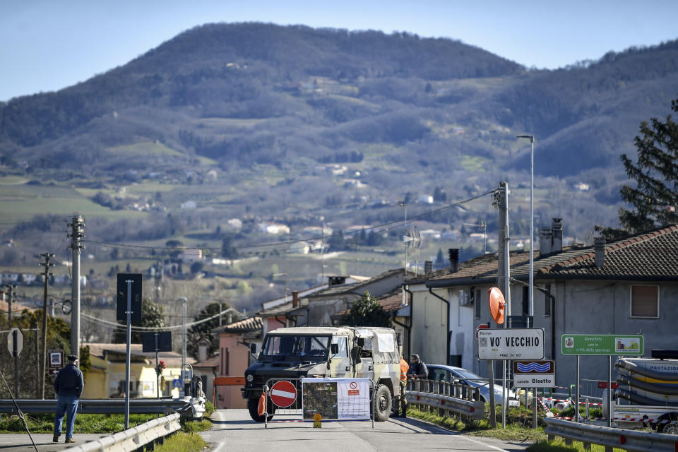 Italian military guard a road block leading to the village of Vo in Italy, where coronavirus numbers have halted. Source: AAP