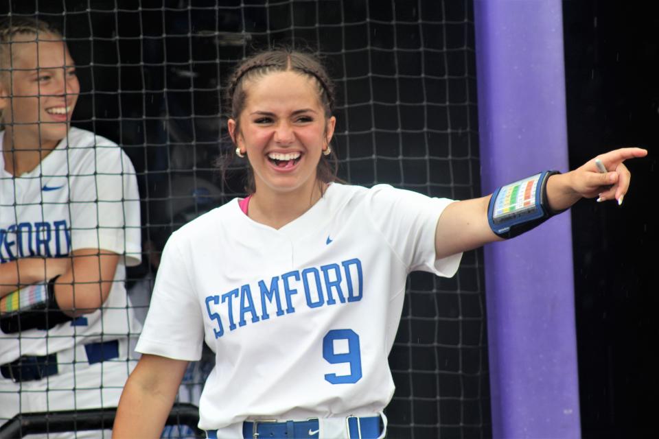 Stamford third baseman Brylee Strand laughs while pointing to the dance moves of opposing Forsan players as a light rain falls on Wells Field at ACU. Which team dance the best was not determined but Stamford won the game handily to advance to its third straight state softball tournament. May 27 2023