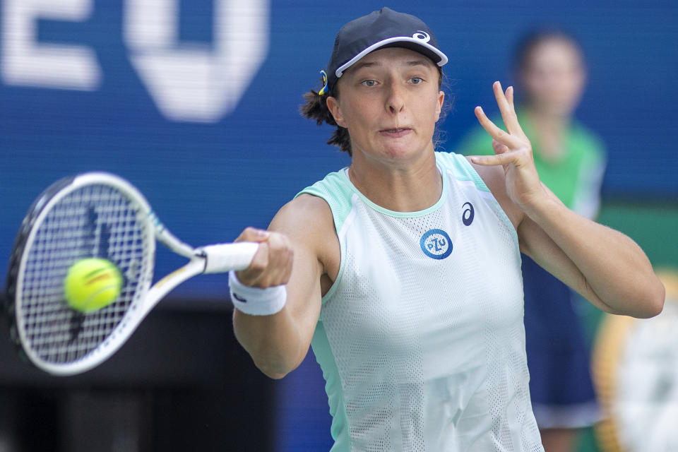 Seen here, World No.1 Iga Swiatek hits a forehand against Sloane Stephens in their second round match at the US Open. 