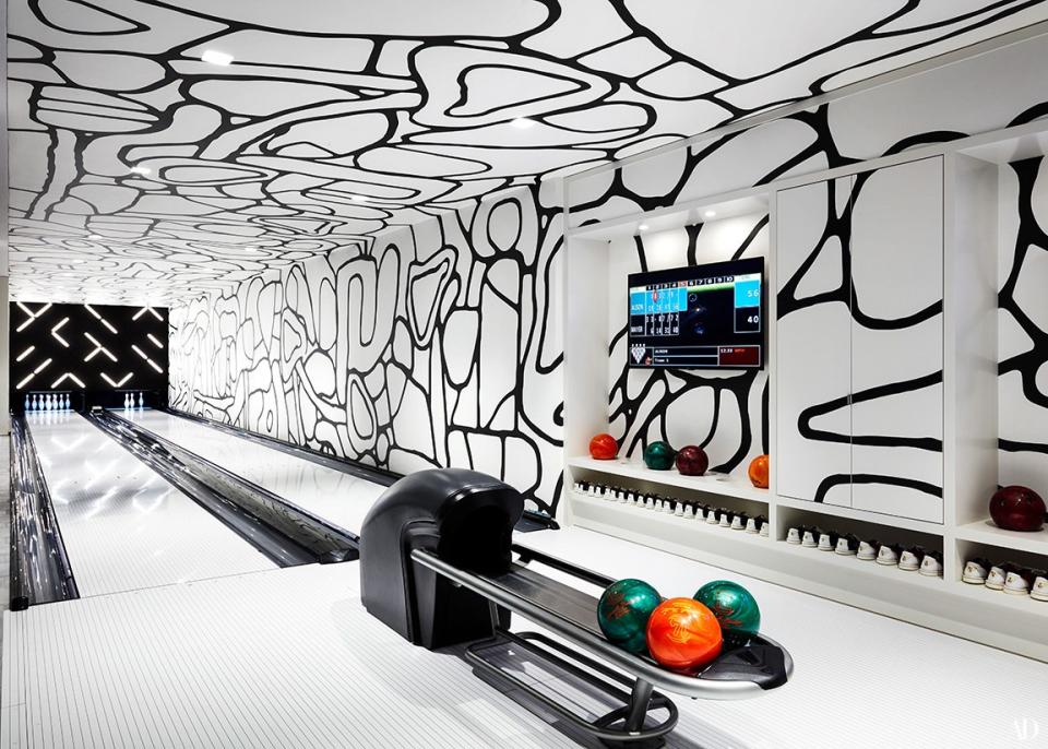 The bowling alley features custom Jean Dubuffet–inspired wallpaper. A neon installation in the style of artist Robert Irwin hangs over the pit.