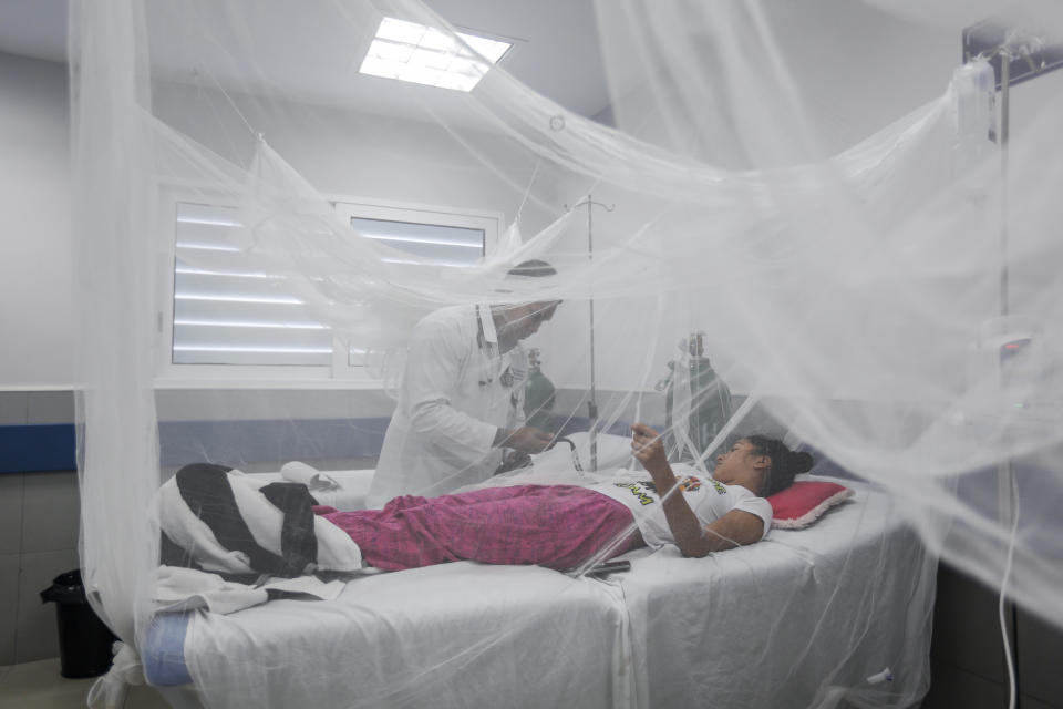 In this photo taken on Sept. 5, 2019, a patient receives treatment for dengue inside a room at the Fernando Velez Hospital in Managua, Nicaragua. As a region, Central America and Mexico have already recorded nearly double the number of dengue cases as in all the previous year. Guatemala, Mexico and Nicaragua have seen double-digit death tolls. (AP Photo/Alfredo Zuniga)