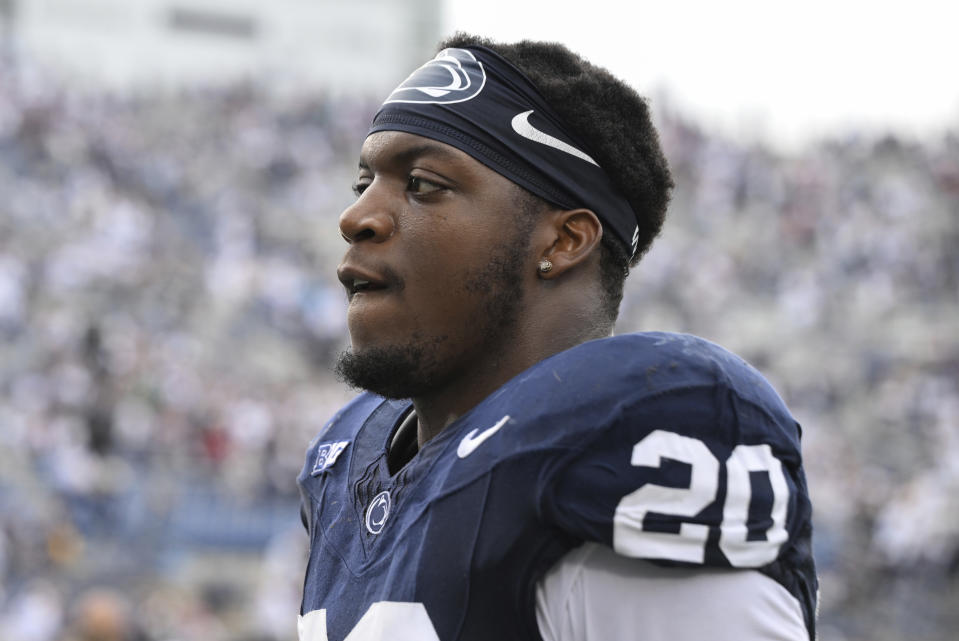 FILE - Penn Penn State defensive end Adisa Isaac (20) celebrates a win over Indiana in an NCAA college football game, Saturday, Oct. 28, 2023, in State College, Pa. The much-anticipated matchup in Saturday’s Peach Bowl is No. 10 Penn State’s top-ranked defense against No. 11 Mississippi’s up-tempo offense. (AP Photo/Barry Reeger, File)