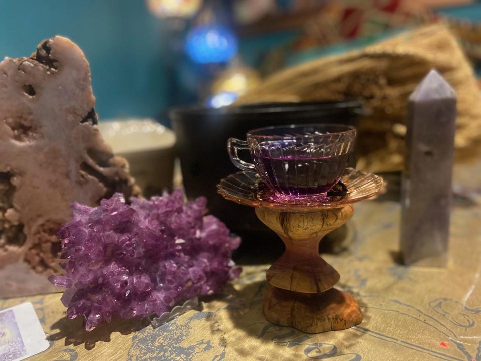 Of Wand and Earth now features a teahouse that offers more than 40 types of tea, including this "magical butterfly" flavor of purple tea that matches with the quartz crystal next to it.