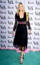 <p>Wearing a black midi dress, with a sheer hemline and sleeves.<i> [Photo: PA Images]</i></p>