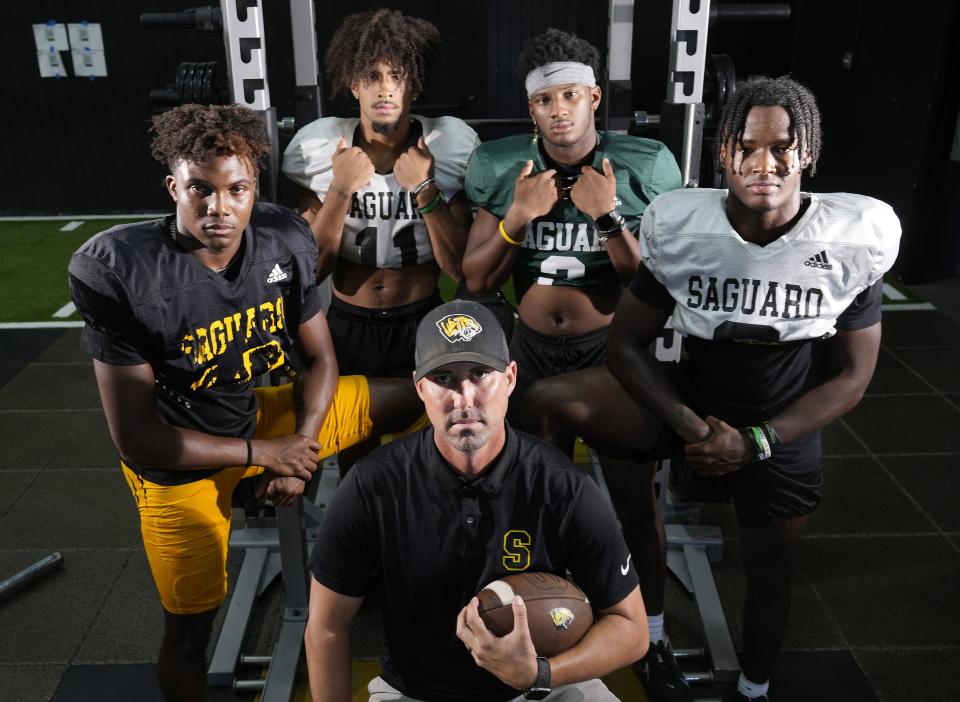 Aug 29, 2022; Scottsdale, Arizona, USA; Saguaro High head football coach Jason Mohns with (from left) Athlete Dajon Hinton, WR Deric English, QB Devon Dampier and RB Jaedon Matthews.