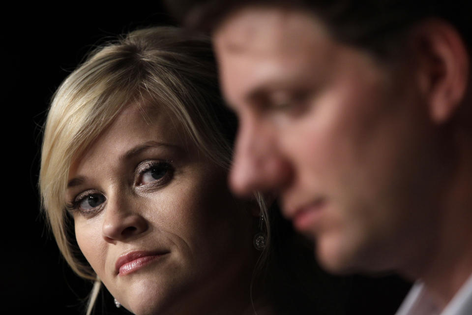 Actress Reese Witherspoon, left, and director Jeff Nichols listen during a press conference for Mud at the 65th international film festival, in Cannes, southern France, Saturday, May 26, 2012. (AP Photo/Lionel Cironneau)