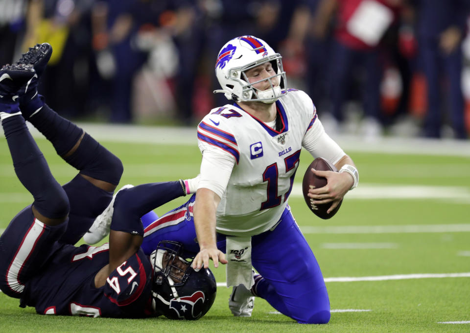 Buffalo Bills quarterback Josh Allen (17) is sacked by Houston Texans linebacker Jake Martin (54) during the second half of an NFL wild-card playoff football game Saturday, Jan. 4, 2020, in Houston. (AP Photo/Michael Wyke)