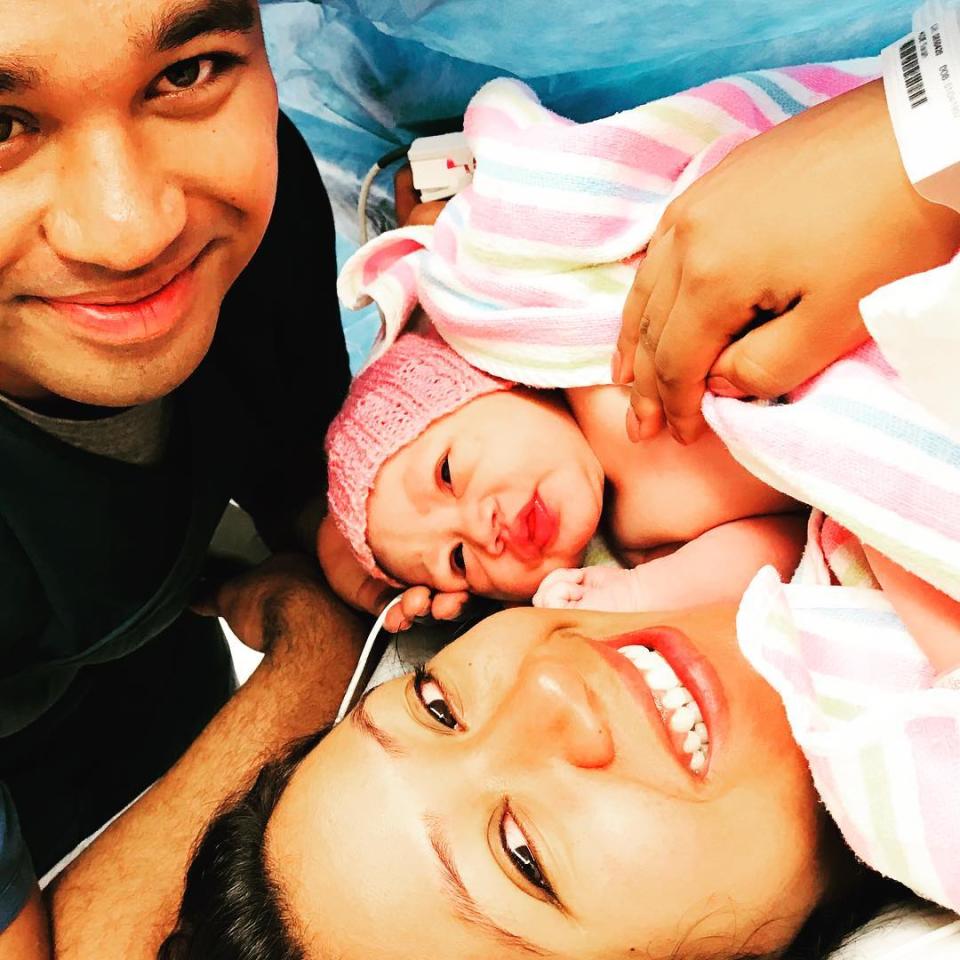 The Brisbane man pictured with his wife in hospital right after the birth of their daughter. 