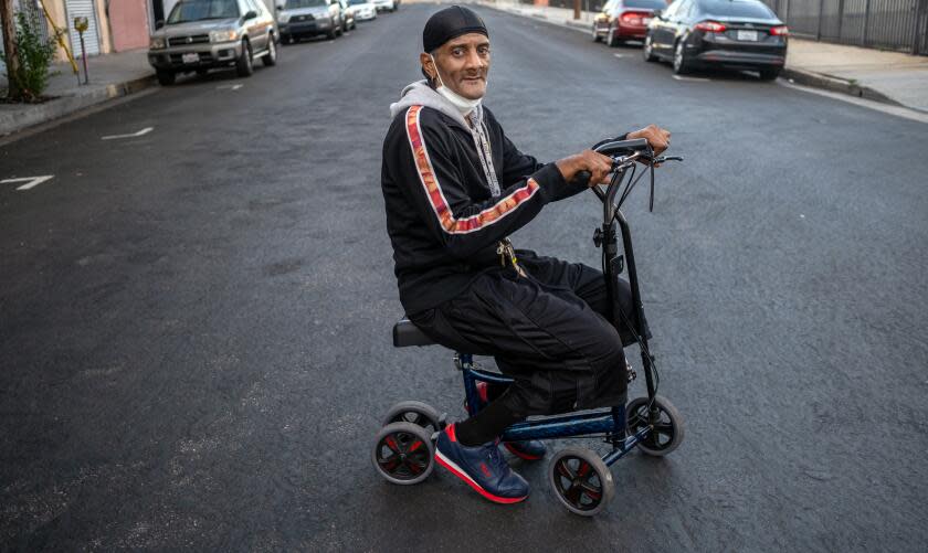 Los Angeles, CA - September 27: Portrait of Marvin Danzey, III, 58, outside the Lincoln Hotel on Wednesday, Sept. 27, 2023, in Los Angeles, CA. Marvin Danzey is a former tenant of the Dewey Hotel. Danzey has significant mobility issues. He left his dentures and most of the rest of his belongings at the Dewey. He was not allowed to go back into the Dewey to pick up his belongings. He was transferred to the Lincoln from the Vagabond less than a month ago. (Francine Orr / Los Angeles Times)
