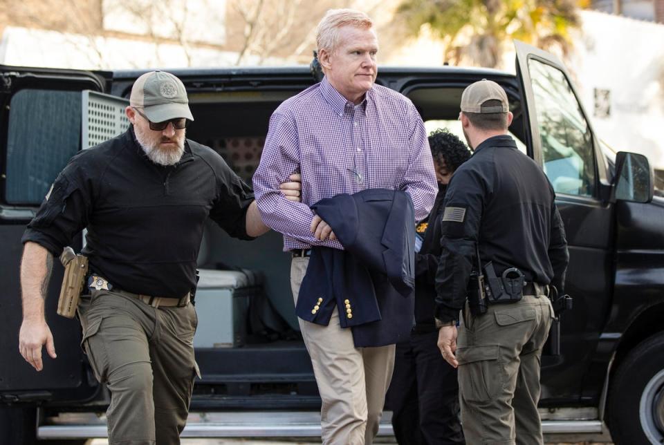 Alex Murdaugh walks into the courthouse before his double murder trial on Wednesday (AP)