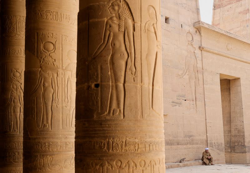 FILE PHOTO: An Egyptian guard sits at the Philae temple complex