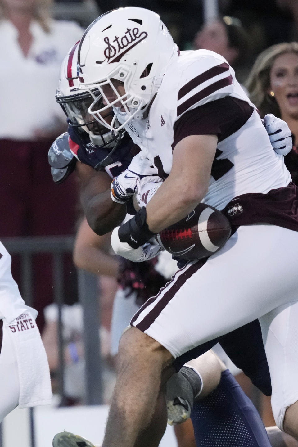 Mississippi State linebacker Jett Johnson (44) holds on to an interception as an Arizona player tries to strip him of the ball during the first half of an NCAA college football game Saturday, Sept. 9, 2023, in Starkville, Miss. (AP Photo/Rogelio V. Solis)