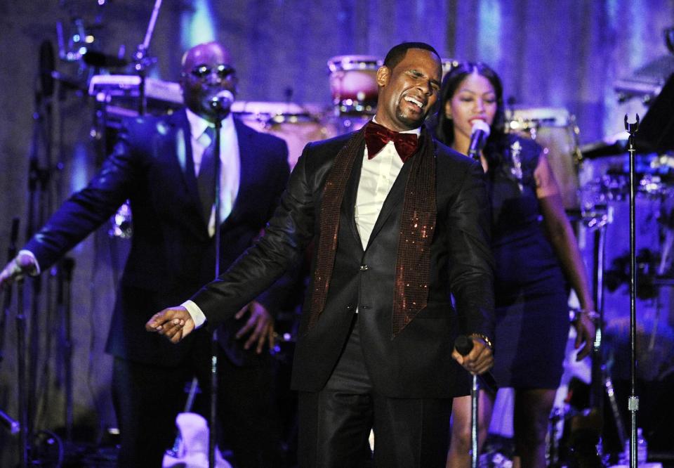 FILE - This Feb. 12, 2011 file photo shows R. Kelly performing at the pre-Grammy gala & salute to industry icons with Clive Davis honoring David Geffen in Beverly Hills, Calif. Kelly is up for the Ashford & Simpson songwriter's award and album of the year, at this year's Soul Train Awards, bringing his career total to 21. He's the most nominated act ever, but he'll have to battle Usher, who leads with five. (AP Photo/Mark J. Terrill, file)