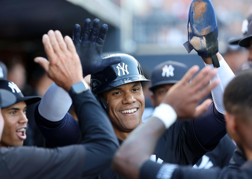 Mar 20, 2024; Tampa, Florida, USA; New York Yankees left fielder Juan Soto (22) is congratulated after he scored a run during the first inning against the Pittsburgh Pirates at George M. Steinbrenner Field. Mandatory Credit: Kim Klement Neitzel-USA TODAY Sports