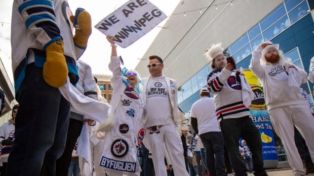 Winnipeg Jets fans get warmed up at the Whiteout Street Party prior to the  second NHL playoff game against the St. Louis Blues during in Winnipeg,  Manitoba, Friday, April 12, 2019. (John