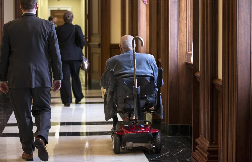 FILE - In this Oct. 5, 2013 file photo, House Democrats, including Rep. John Dingell, D-Mich., center, the longest-serving member of Congress in American history, make their way to the office of House Minority Leader Nancy Pelosi before a vote in Congress, at the Capitol in Washington. Dingell, who served in the U.S. House for 59 years before retiring in 2014, died Thursday, Feb. 7, 2019, at his home in Dearborn, said his wife, Congresswoman Debbie Dingell. He was 92. (AP Photo/J. Scott Applewhite)