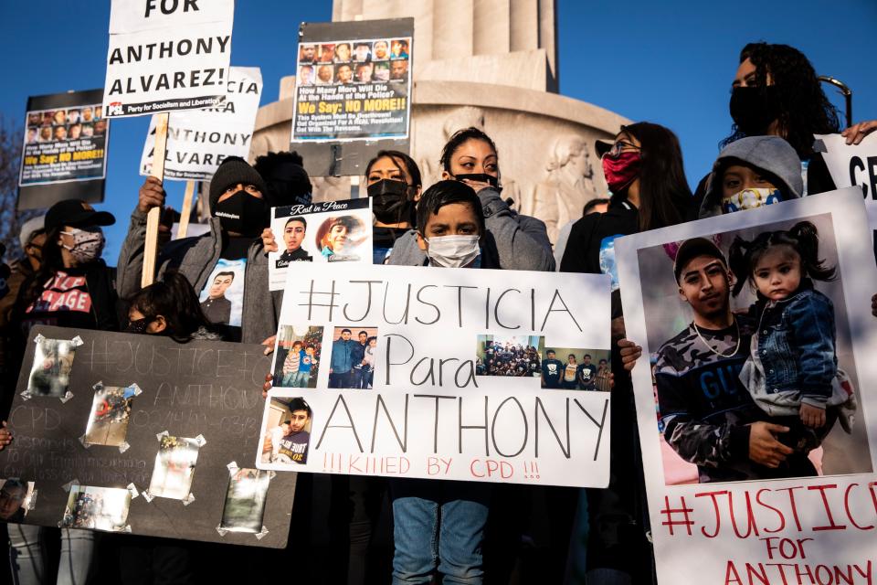 More than a thousand people gather in front of the Logan Square Monument to protest the fatal shooting by Chicago police of 13-year-old Adam Toledo, Friday, April 16, 2021 in Chicago.