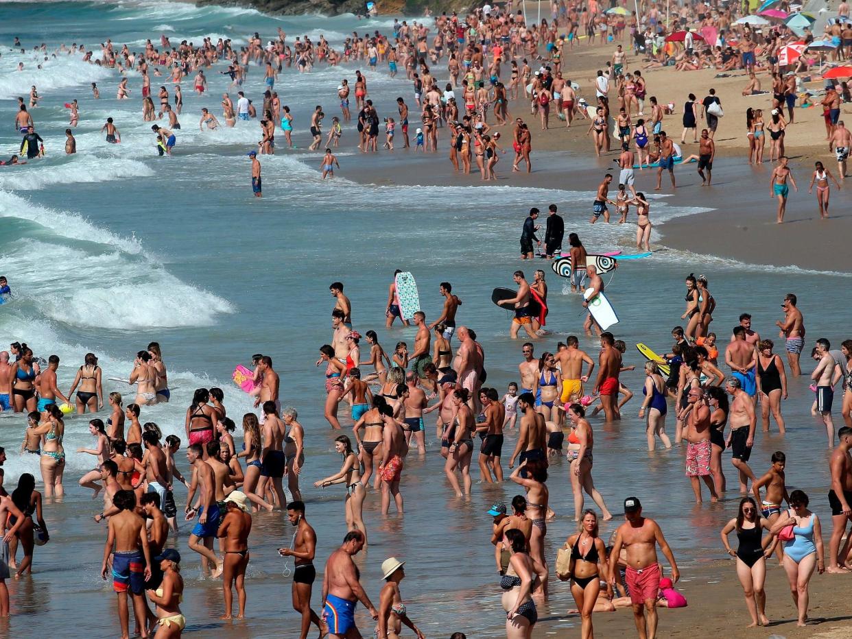 People on the beach at Biarritz, southwestern France: AP