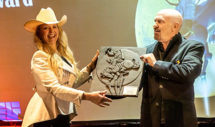Gwynn Shotwell receives the Space Cowboy award from Rick Tumlinson. (Credit: Rick Tumlinson)