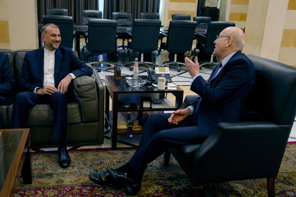 Lebanese caretaker Prime Minister Najib Mikati, right, meets with Iranian Foreign Minister Hossein Amirabdollahian in Beirut, Lebanon, Saturday, Feb. 10, 2024. (AP Photo/Bilal Hussein)
