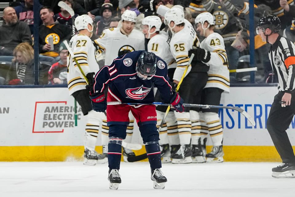 Jan 2, 2024; Columbus, Ohio, USA; Columbus Blue Jackets center Adam Fantilli (11) reacts to a goal by Boston Bruins center Trent Frederic (11) during the third period of the NHL hockey game at Nationwide Arena. The Blue Jackets lost 4-1.