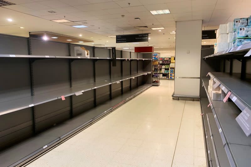 Empty shelves are seen at a supermarket in Canary Wharf in London